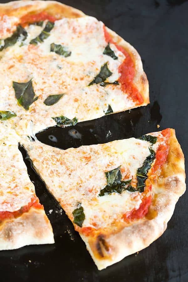 This Neapolitan pizza crust is thin, crispy and has the most amazing flavor. My homemade pizza-making is forever changed!