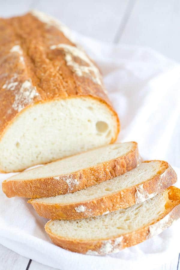 This Italian bread recipe takes some time to come together, but the hard crust and chewy bread are 100% worth it. Totally necessary with a bowl of pasta or a hearty soup! 