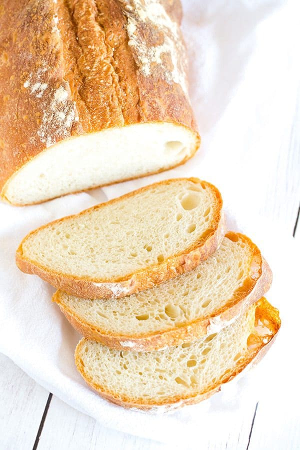 This Italian bread recipe takes some time to come together, but the hard crust and chewy bread are 100% worth it. Totally necessary with a bowl of pasta or a hearty soup!