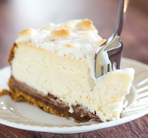 S'mores Cheesecake - The ultimate summer dessert! Graham cracker crust, chocolate fudge, and marshmallow cheesecake, all topped with toasted marshmallows.