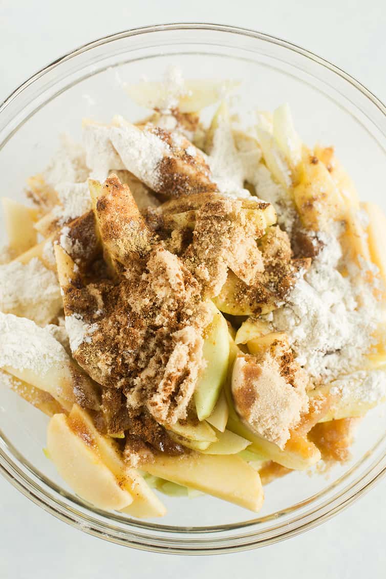 The filling for apple crisp prepped in a bowl.