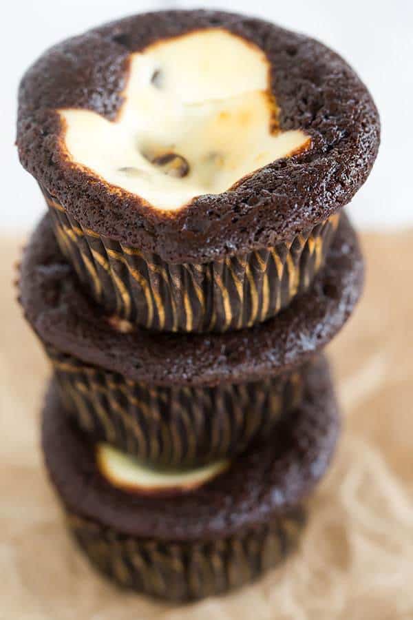 Classic black-bottom cupcakes - super moist chocolate cupcakes topped with a cheesecake filling and mini chocolate chips. The best of both worlds!