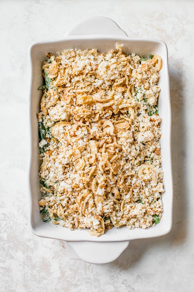 Green bean casserole assembled in a baking dish ready to be baked.