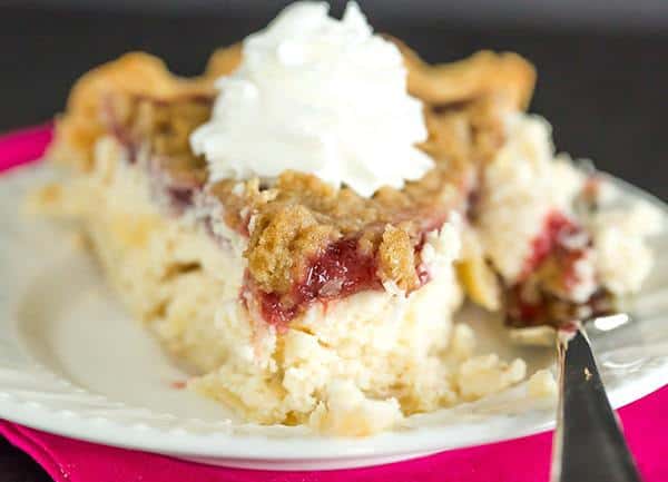 This Cranberry Cheesecake Crumb Pie features pie crust filled with a simple cheesecake batter, then topped with a thick cranberry sauce and crumb topping.