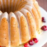 This Cranberry Pound Cake is wonderfully dense, moist and loaded with fresh cranberries. Topped with a simple orange glaze, it's perfect for the holidays.