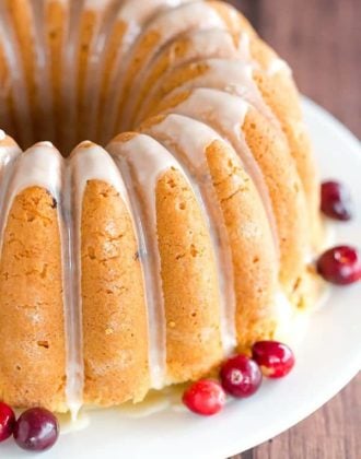 This Cranberry Pound Cake is wonderfully dense, moist and loaded with fresh cranberries. Topped with a simple orange glaze, it's perfect for the holidays.