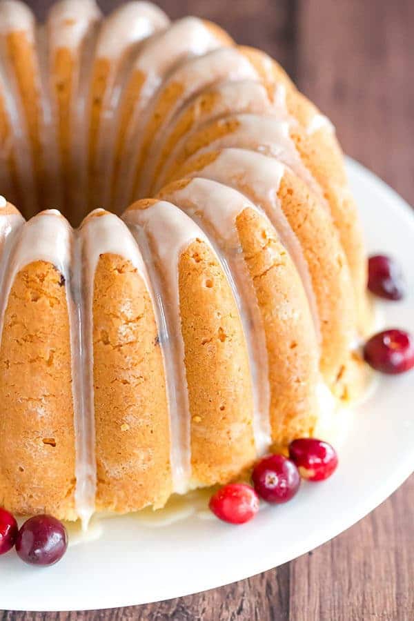 This Cranberry Pound Cake is wonderfully dense, moist and loaded with fresh cranberries. Topped with a simple orange glaze, it's perfect for the holidays.