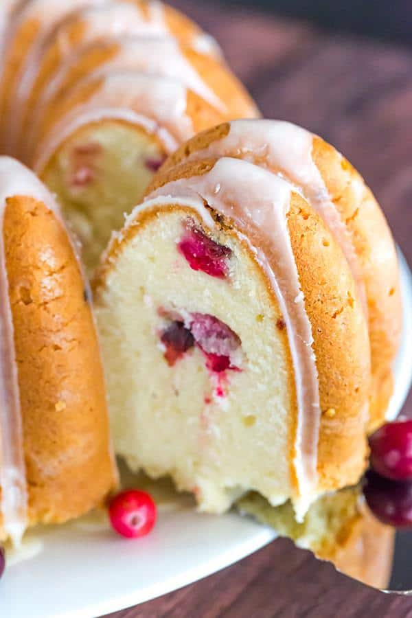 This Cranberry Pound Cake is wonderfully dense, moist and loaded with fresh cranberries. Topped with a simple orange glaze, it's perfect for the holidays.
