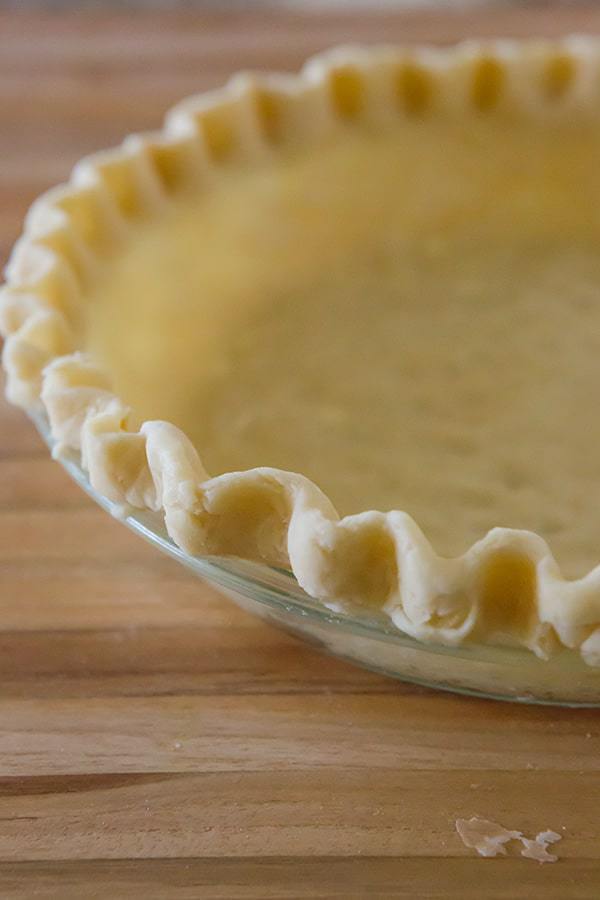 The BEST pie crust recipe you'll ever find! It's easy to work with, tender and flaky. You won't believe the secret ingredient!