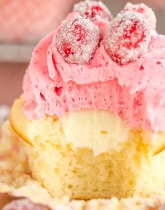 Sparkling Cranberry White Chocolate Cupcakes - Vanilla cupcakes with white chocolate ganache filling and cranberry buttercream frosting. | browneyedbaker.com
