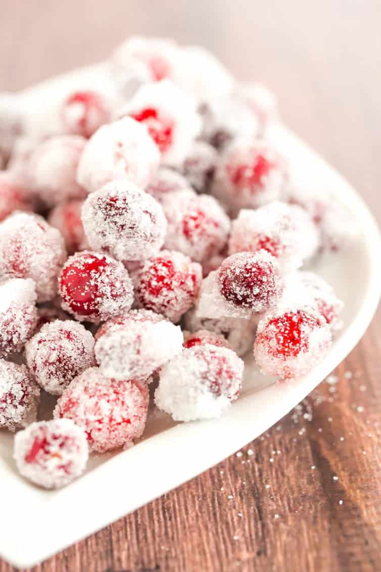 An easy recipe for sugared cranberries - a beautiful, sparkly garnish for your holiday desserts and cocktails! | browneyedbaker.com