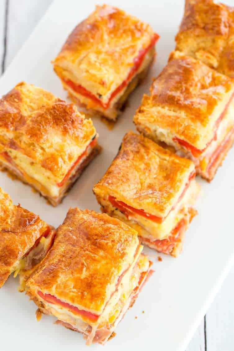 This easy antipasto appetizer bake features layers of Italian meats and cheese, sandwiched between layers of crescent dough. Great for parties!