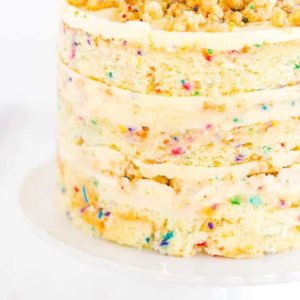 The famous Momofuku Milk Bar Birthday Layer Cake - Layers of funfetti cake loaded with sprinkles, vanilla frosting, and birthday cake crumbs!
