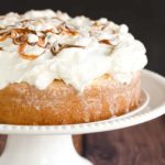Caramel Tres Leches Cake topped with fresh whipped cream.