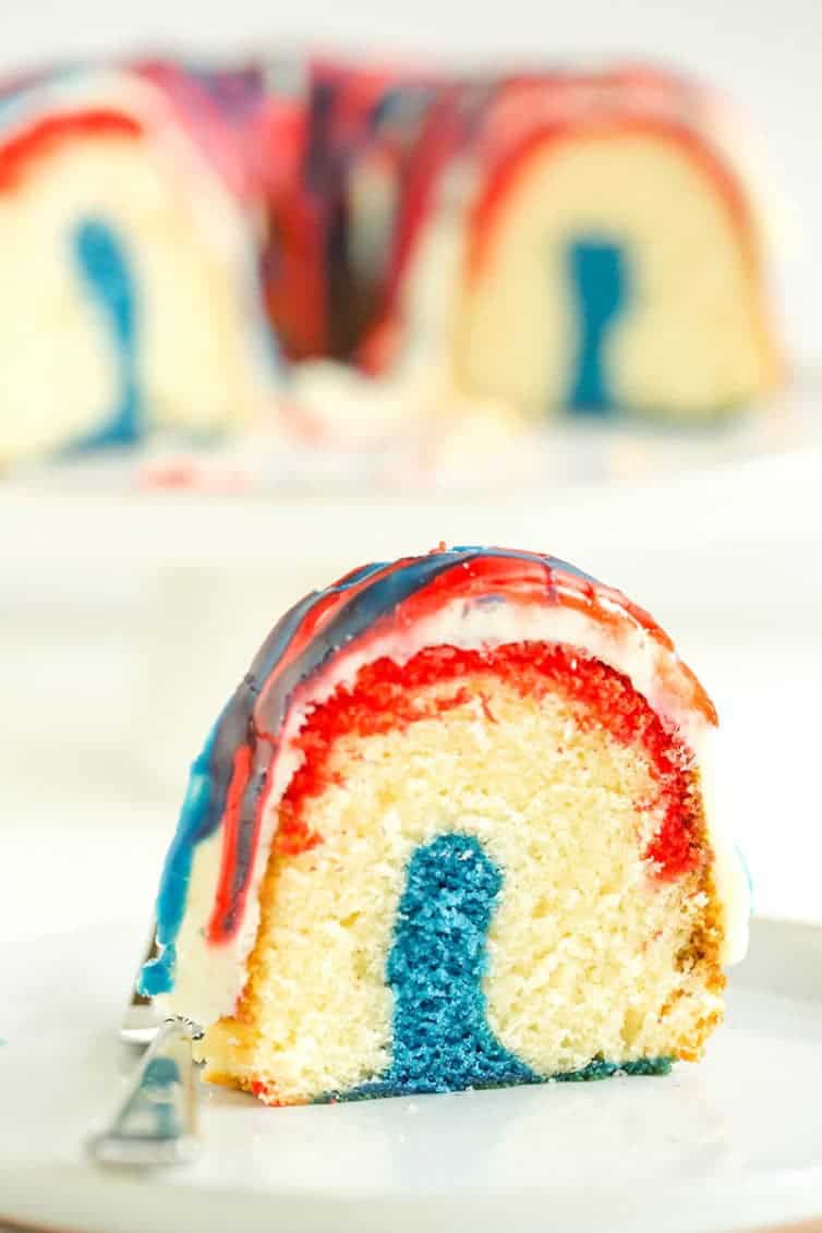 A slice of homemade Firecracker Cake - red, white and blue layered Bundt cake!