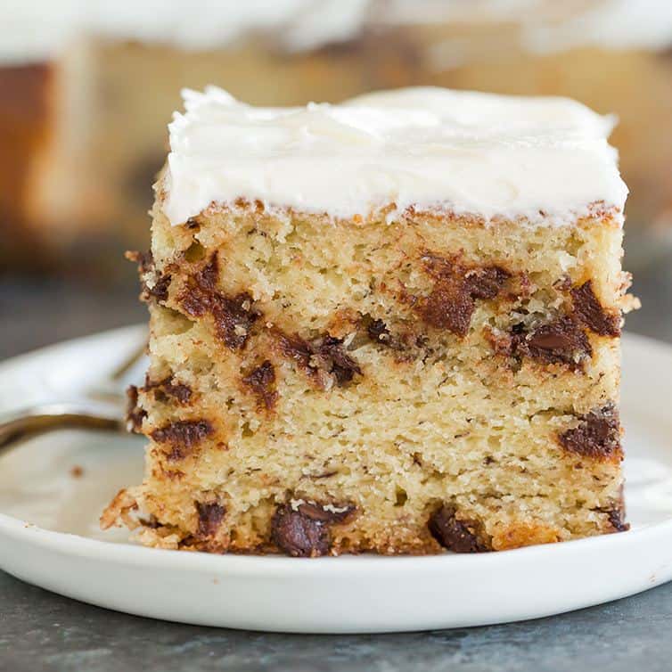 Banana-Chocolate Chip Snack Cake - Super easy, fluffy and moist, loaded with chocolate chips, and topped with cream cheese frosting.