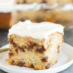 A beautiful slice of Banana-Chocolate Chip Snack Cake slathered with cream cheese frosting.