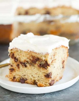 A beautiful slice of Banana-Chocolate Chip Snack Cake slathered with cream cheese frosting.