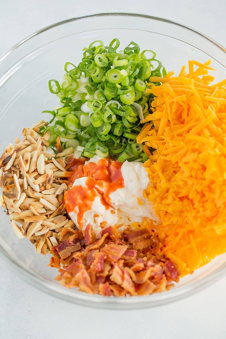Neiman Marcus Dip - A quick and easy combination of bacon, cheddar, scallions, mayo, toasted almonds and hot sauce! 