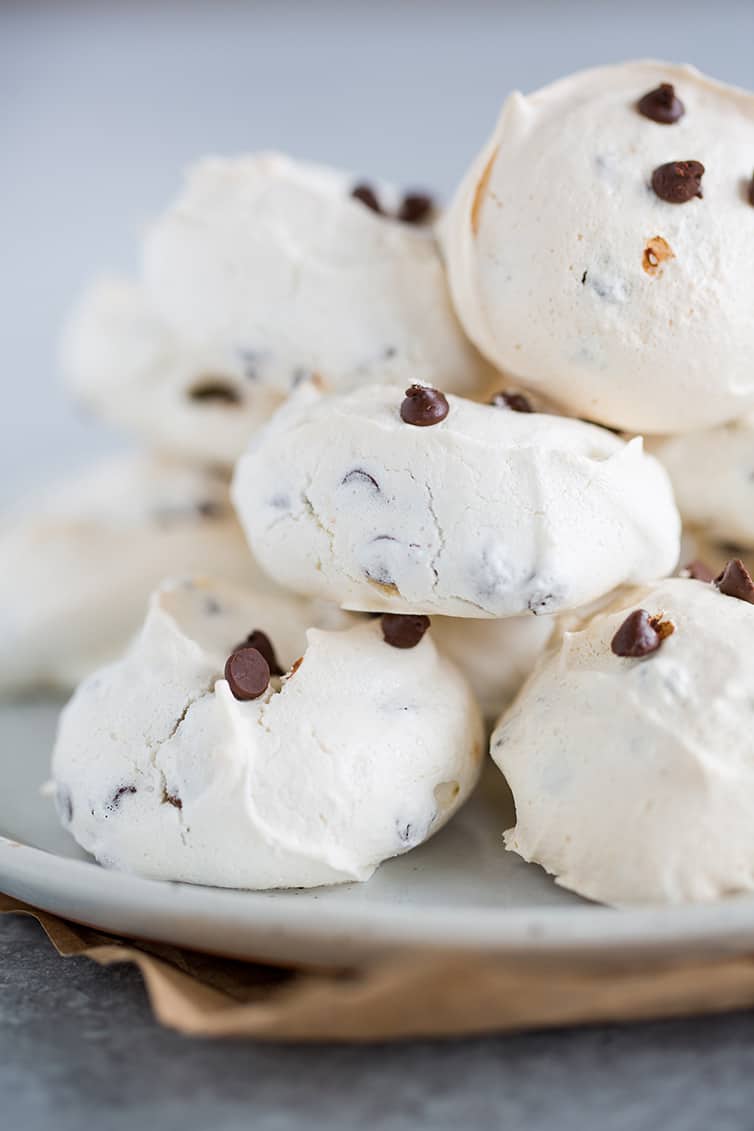 A plate full of Chocolate Chip Meringue Cookies.
