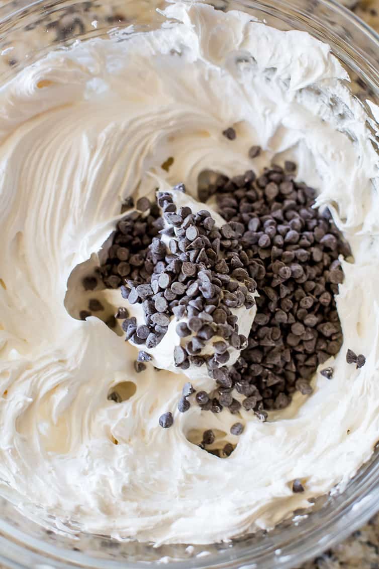 Perfectly whipped up meringue with chocolate chips ready to be stirred in.