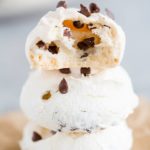 A stack of chocolate chip meringue cookies with a bite taken out!