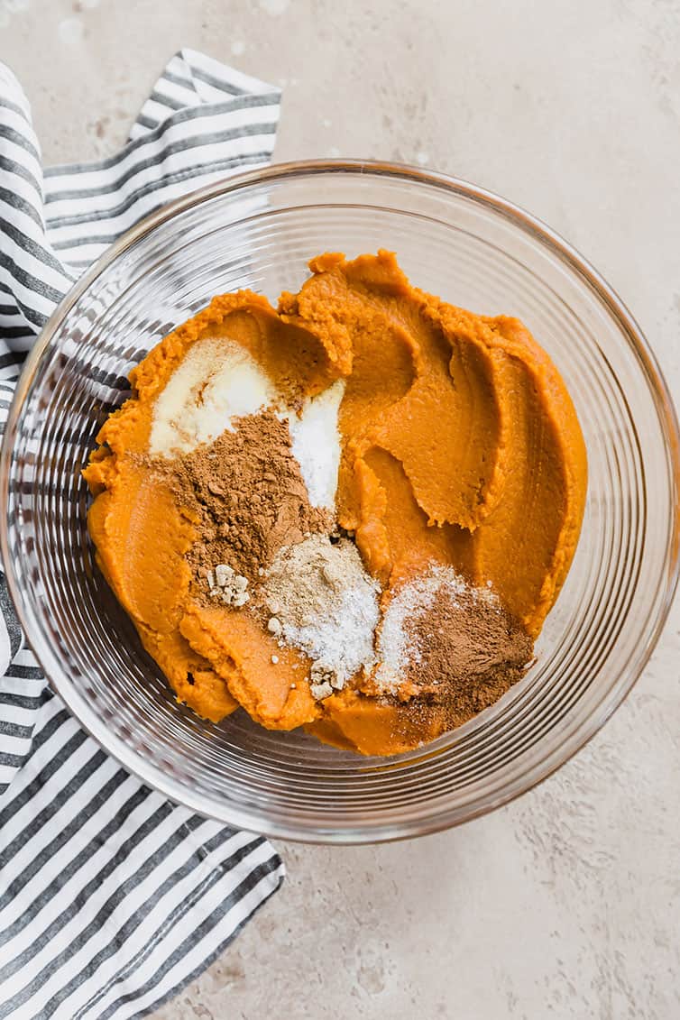 A bowl with pumpkin puree, sugar, and spices.