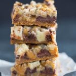 A stack of four caramel apple magic bars.