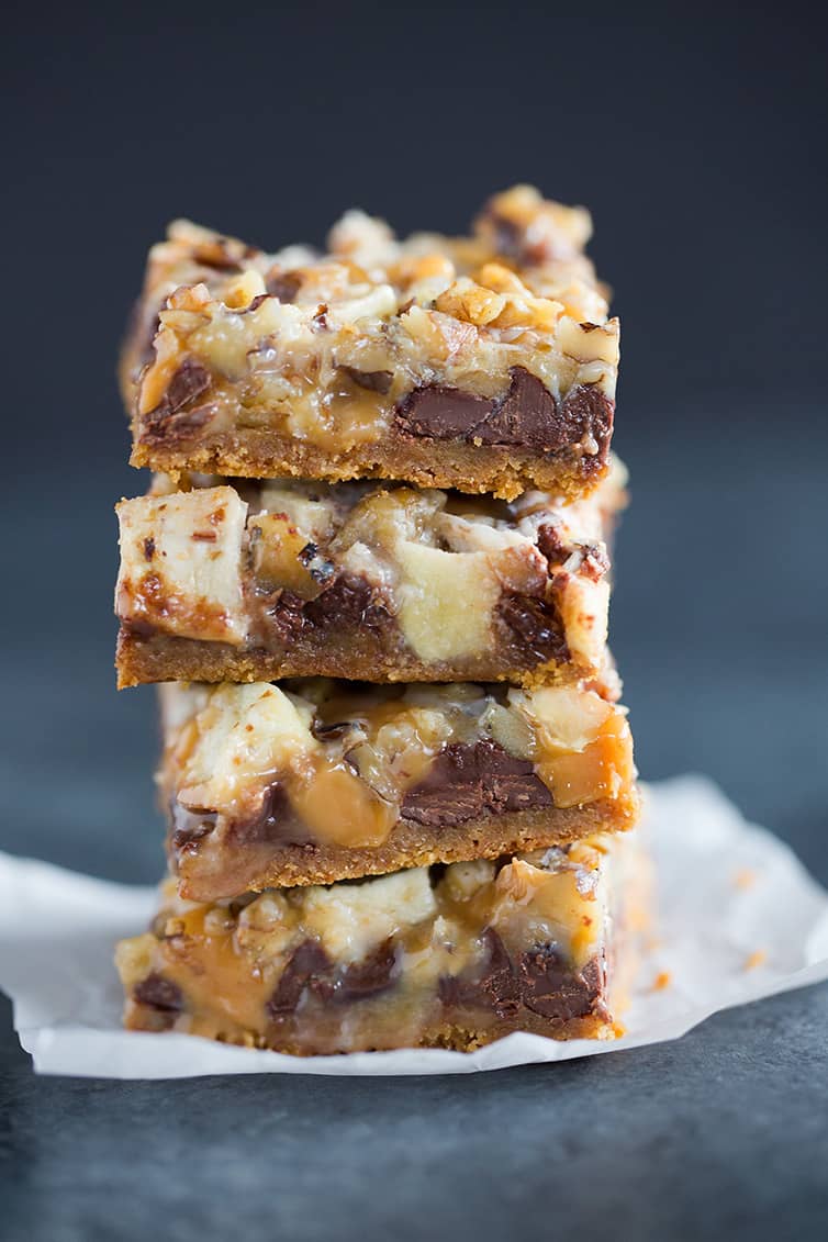 A stack of four caramel apple magic bars.