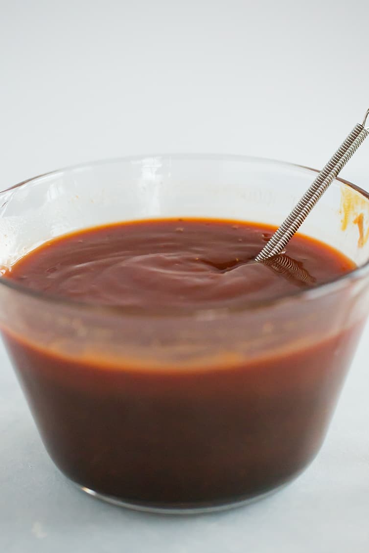 A bowl of homemade bbq sauce after being whisked together.