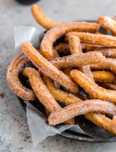 A platter piled high with churros.