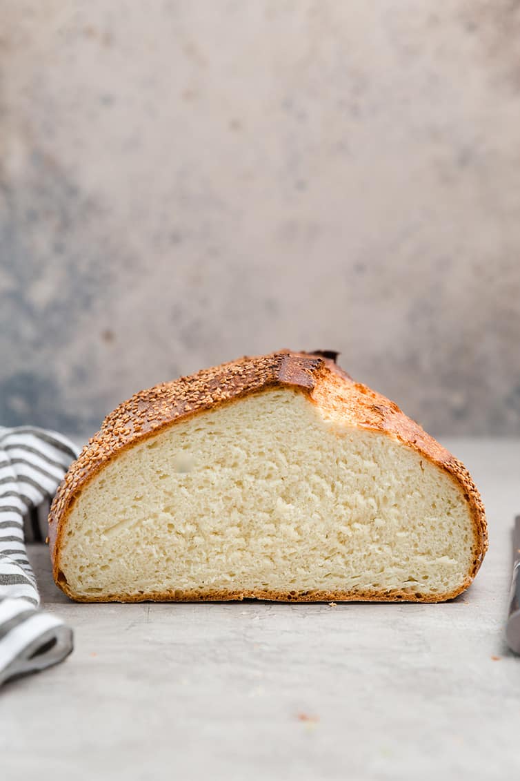 A loaf of Italian bread sliced in half.