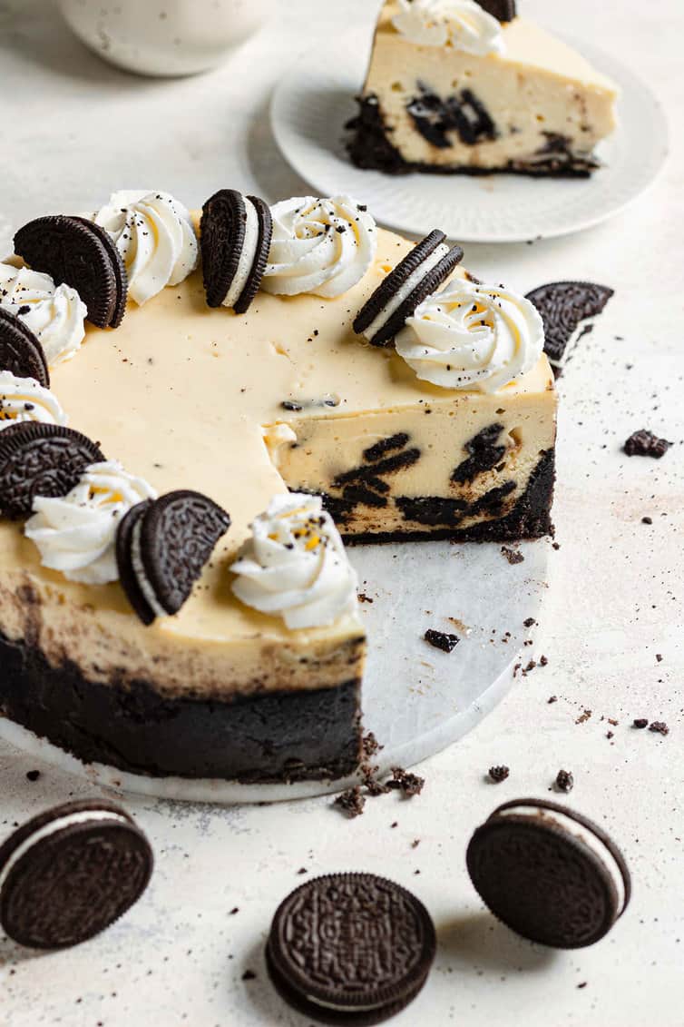 Oreo cheesecake with section missing.