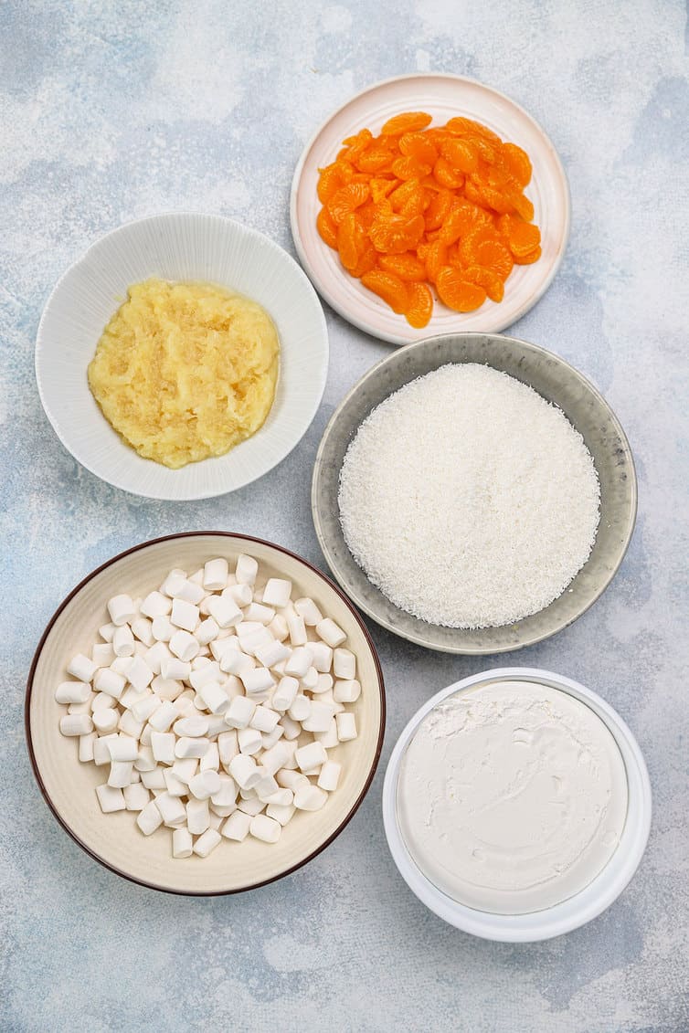 Ingredients for ambrosia prepped in bowls.