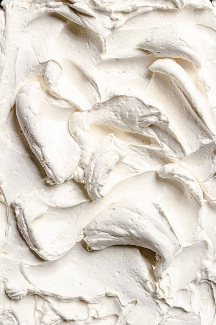 Closeup photo of swirls of Swiss meringue buttercream frosting