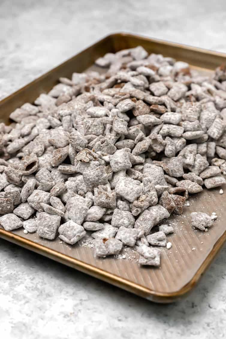 Muddy buddies on a baking sheet.