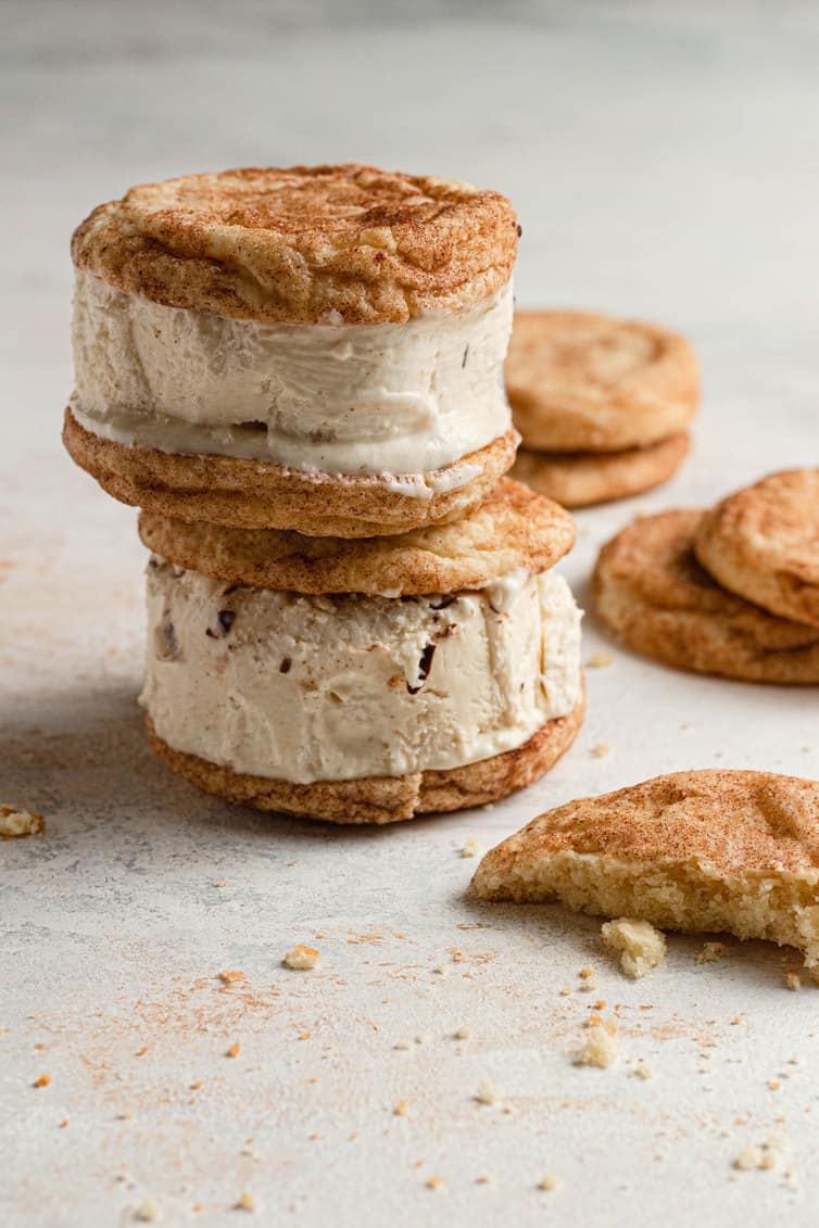 Two snickerdoodle ice cream sandwiches stacked on top of each other.