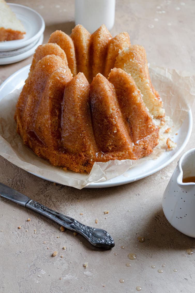A Bundt style butter cake on a serving plate.
