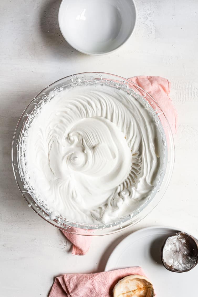 Whipped meringue in a mixing bowl.