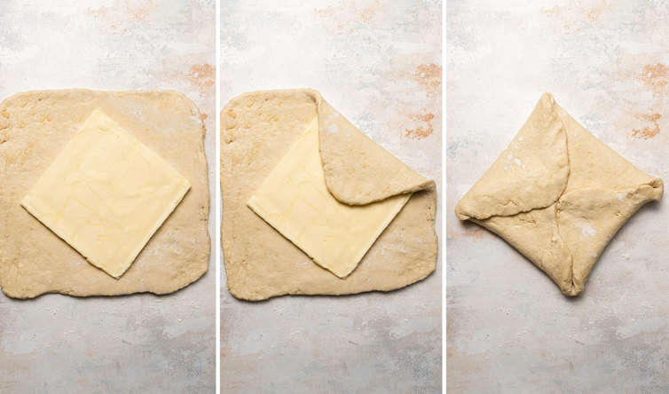 Butter block getting encased in croissant dough.
