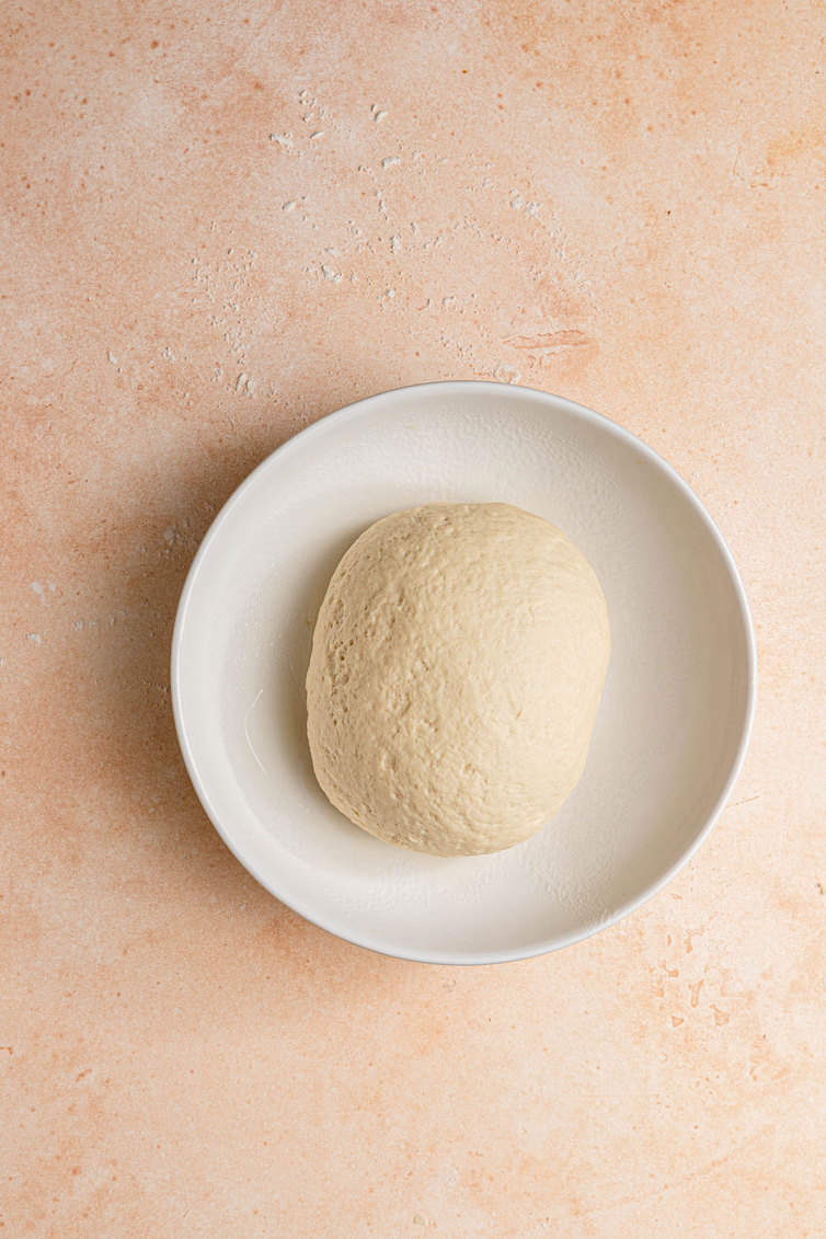 Ball of dough in a bowl.