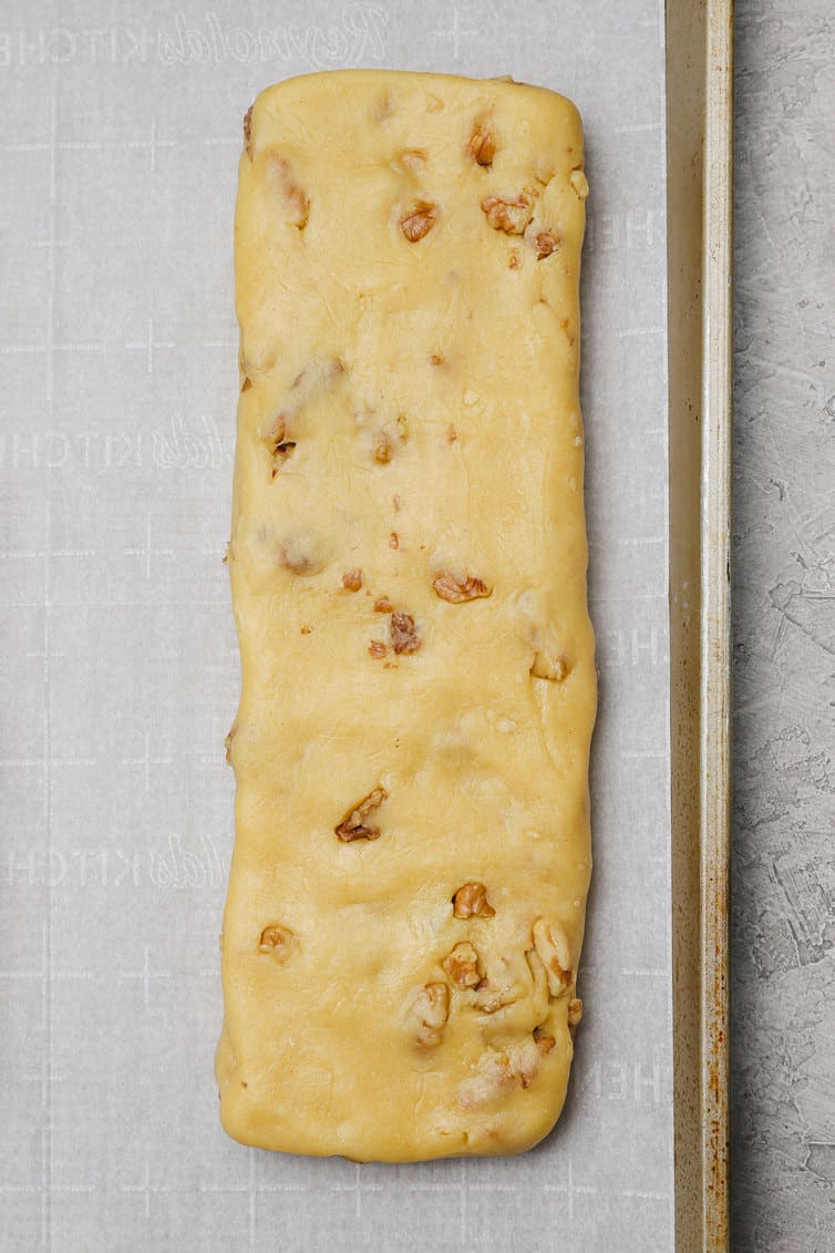 One log of biscotti dough on baking sheet.