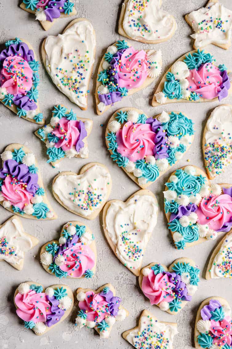 Overhead photo of sugar cookies decorated with buttercream frosting.