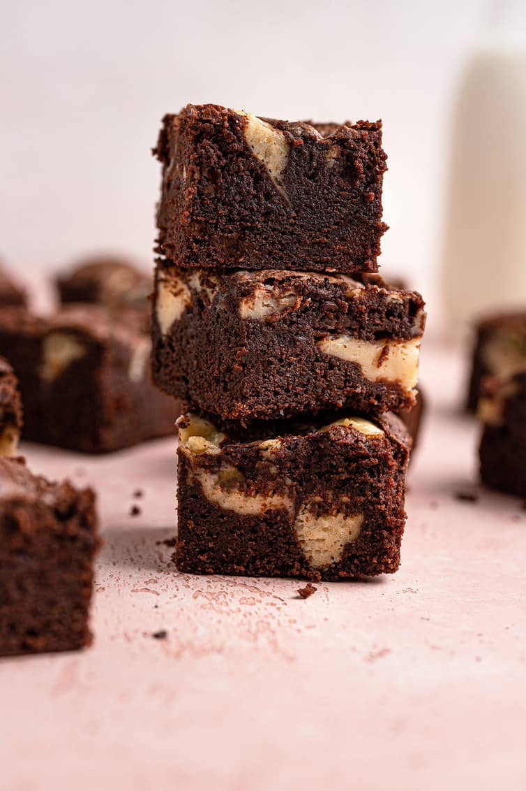 A stack of three cream cheese brownies.