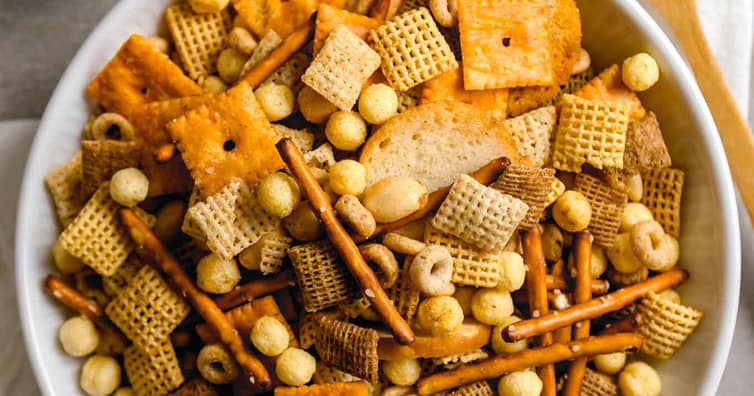 Homemade nuts and bolts snack mix with cereals, pretzels, and nuts