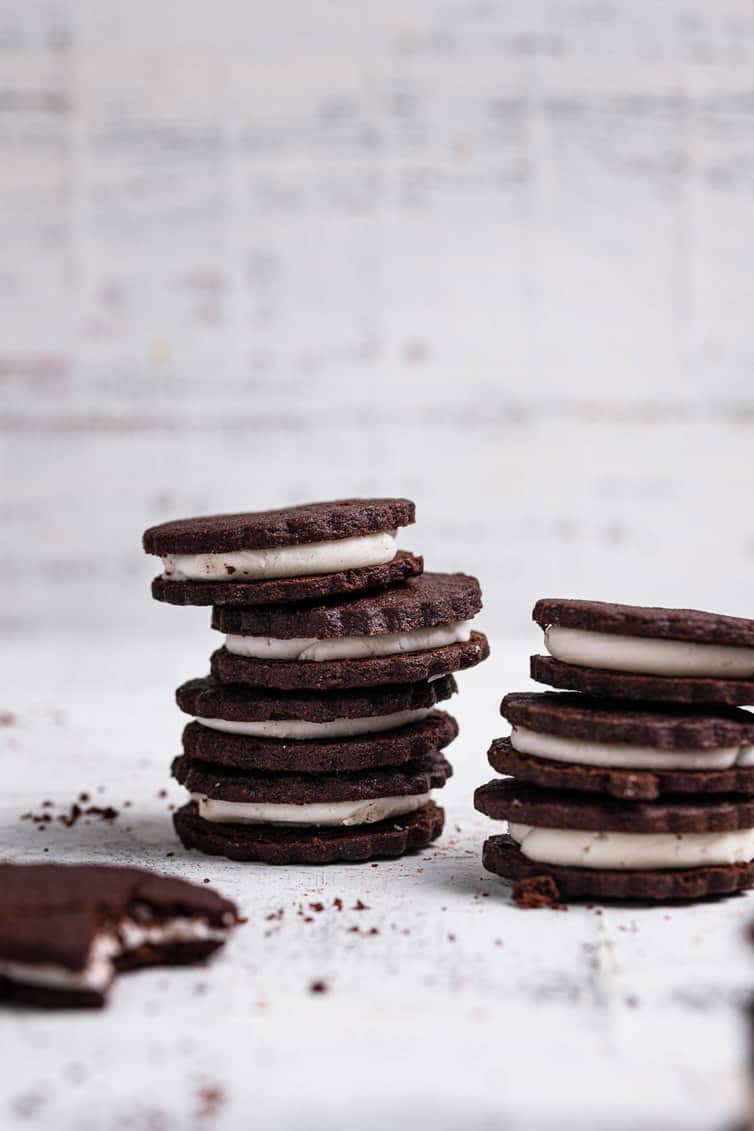 Homemade Oreo cookies stacked in two rows.