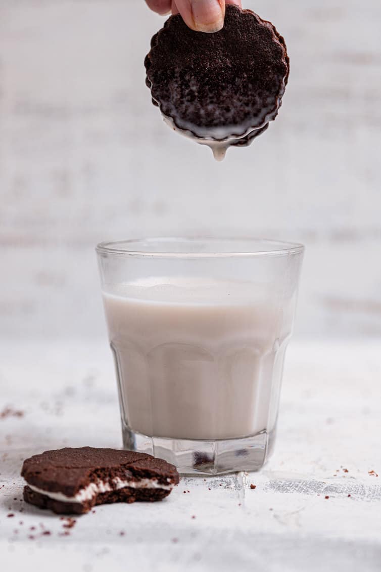 Dipping a homemade Oreo into a glass of milk.