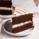 A slice of chocolate Guinness cake on a white plate.