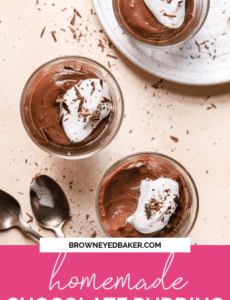 A top down photo of three glasses of pudding with whipped cream and chocolate shavings with two spoons to the bottom left and a pink rectangle at the bottom that says homemade chocolate pudding.