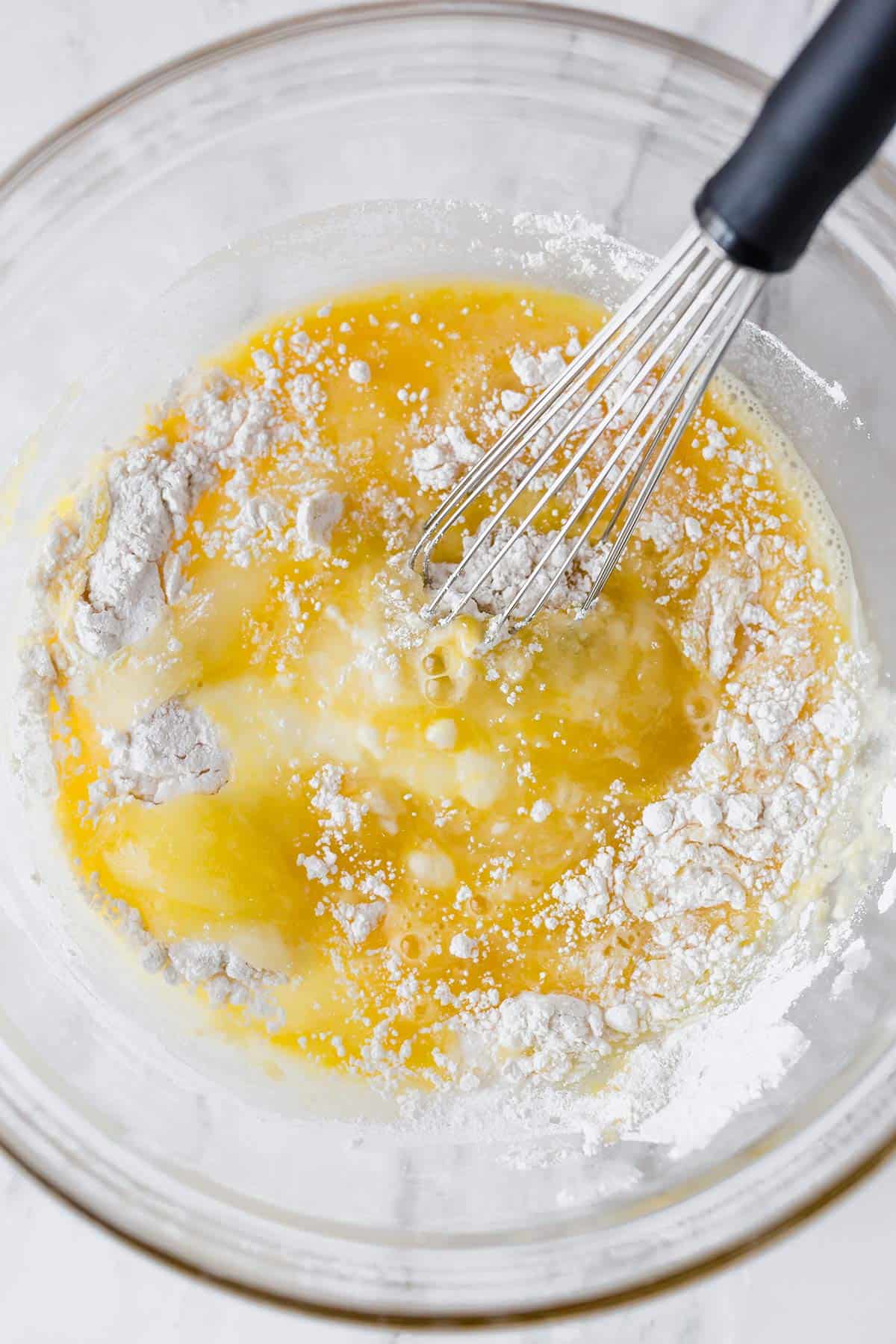 Mixing together the filling for lemon bars.